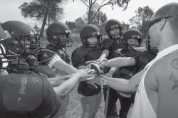 BREAKING BARRIERSmdash;Ventura County Wolfpack players gather after a drill. The Wolfpack, the first 11- on-11 womenrsquo;s tackle football team in the area, plays its first game April 11 against the Arizona Assassins. Photos by MICHAEL COONS/Acorn Newspapers 