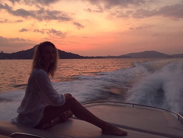 Picture perfect: The model looked like she was always ready for the camera as she was pictured in front of a sunset backdrop