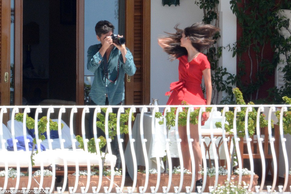 The lady in red: Swishing her hair around for dramatic effect, Caitlin put on another sexy display in a little red dress