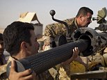 Iraq Kurdish Peshmerga fighters load a recoilless rifle before firing it towards Islamic State (IS) positions during heavy clashes in Tuz Khurmatu in Salaheddin province about  88 kilometres (55 miles) south of Kirkuk on August 31, 2014. Iraqi forces broke through to the jihadist-besieged Shiite town of Amerli, where thousands of people have been trapped for more than two months with dwindling food and water supplies. AFP PHOTO/ JM LopezJM LOPEZ/AFP/Getty Images