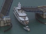 A drawbridge near Bay Harbor Islands in Flrodia partially collapsed onto A 161-foot superyacht called the Rockstar became lodged beneath a drawbridge neat Bay Harbour Islands in Florida Tuesday. The boat, which costs more than $250,000 to charter for a week, was carrying a dozen people at the time, but everyione escaped unharmed. A part of the bridge came down on the top part of the yachtnext to a hot tub.The Rockstar remained trapped for more than 20 minutes became trapped aged drawbridge and reamined imovable for more than 20 minutes before it finally became dislodged. The impressive vessel, built by Trinity Yahcts in 2009, features fvie stateroom,s and a two-level master suitedyahct was then towed   saloon and dining room boast spectacular light fittings and are lined with black and white stills of 1950s and 1960s Hollywood film stars.with a private lounge, his and her bathrooms, excellent storage facilities and 280 degree views over the oceanthe yacht, with