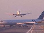 Dramatic footage: The video shows the moment a plane was forced to abort its landing after another plane taxis across its path at Barcelona airport