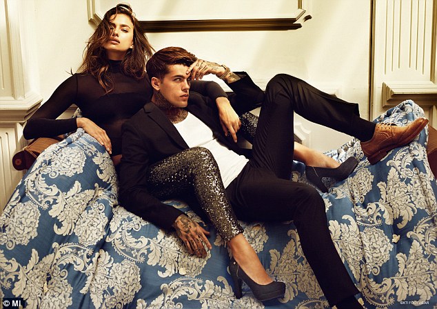 Lounging around: The model seductively wrapped her legs around the Scottish hunk