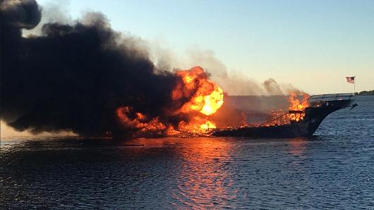 In this photo provided by Pasco County flames engulf a boat Sunday, Jan. 14, 2018, in the Tampa Bay area. The boat ferrying patrons to a casino ship off the Florida Gulf Coast caught fire near shore Sunday afternoon, and dozens of passengers and crew safely made it to land with some jumping overboard to escape, authorities said.