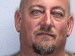 Arrested: Mike Doster was charged with domestic battery after a violent argument with his wife while jet skiing during which she accused him of performing oral sex on another man