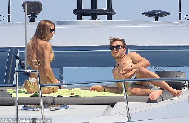 Winning: Germany World Cup winner Gotze and his model girlfriend Brommel relax