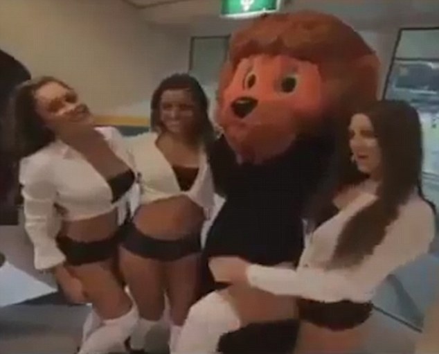 The lingerie models later posed with the team mascot for this behind-the-scenes Valentine's Day photograph