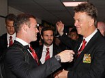 All smiles: New Manchester United manager shares a joke with frontman Wayne Rooney at the airport