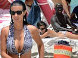 Chillied: Bacary Sagna relaxes in Miami with his wife Ludivine before joining Manchester City