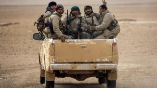 File photo shows members of the Syrian Democratic Forces (SDF) in vehicle north of Raqqa (8 February 2017)