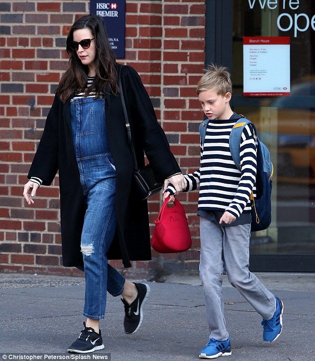 About to be a big brother! She also has a 10-year-old son Milo with ex-husband British rocker Royston Langdon, whom she divorced in 2010 (pictured November 7)