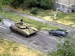 Russia was accused of sending tanks into Ukraine today with Kiev claiming three T-72 tanks entered the country in Snizhne - some 13 miles inside Ukraine. It comes as attention was diverted to chaos in Iraq