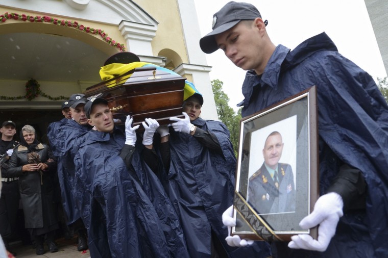 Pallbearers carry the coffin of General Serhiy Kulchytsky during his funeral in Lviv. Kulchytsky was one of 14 servicemen killed when separatists shot down a helicopter in eastern Ukraine on May 29. (Roman Baluk/Reuters)