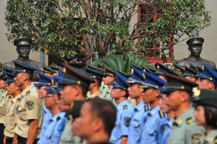 Military soldiers and officers attend an opening ceremony of Memorial of the August 1 Nanchang Uprising after a renovation ahead of the 90th anniversary of the founding of the People's Liberation Army (PLA) in Nanchang, Jiangxi province, China July 28, 2017.  REUTERS/Stringer