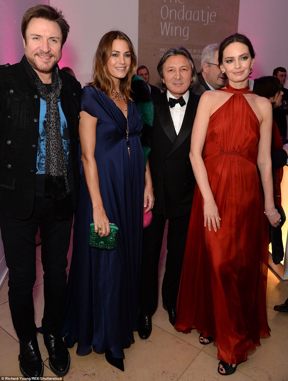 Power pairs: Simon and Yasmin took a moment to pose with fellow married power couple designer Leon Max and his wife Yana