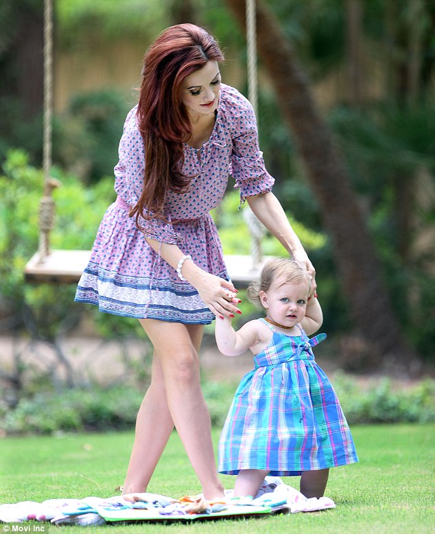 Carefully does it! Holly held on to Rainbow as she took tentative steps across the grass