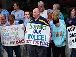 A rally was held Sunday afternoon in support of St Louis police officer Darren Wilson, who shot dead black teen Michael Brown earlier this  month