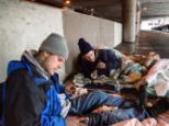 Heroin addicts Ozzy, left, and John prepare their morning hit in a car park in Chicago, Illinois. The city's homeless often fall prey to heroin addiction