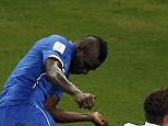 Heads up: Italy striker Mario Balotelli (left) scores second goal against England