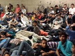 Overflowing: Immigration authorities have opened a shelter at Lackland Air Force Base in Texas to house a rising number of unaccompanied minors who have been crossing the U.S.-Mexico border illegally