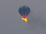 Fiery crash: This hot air balloon carrying at least three people caught fire mid-flight and went down in Virginia