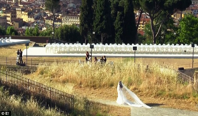 Here comes the bride: The end of the episode shows a glimpse of Kim walking to the aisle at her Florence wedding to Kanye West