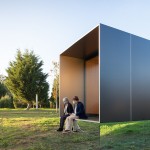 MIMA Light is a small prefabricated house raised up from the landscape on a near-invisible base