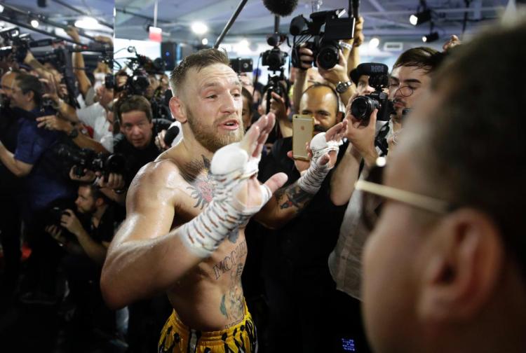 Conor McGregor reacts during a media workout Friday, Aug. 11, 2017, in Las Vegas. McGregor is scheduled to fight Floyd Mayweather Jr. in a boxing match Aug. 26 in Las Vegas. (AP Photo/John Locher)