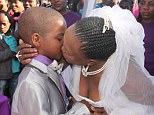 Groom Sanele Masilela (9) gets a kiss from his bride Helen Shabangu (63)  at their second ritual marriage ceremony