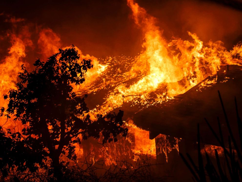 PHOTO: Flames engulf a home as brush fire sweeps through the area threatening structures on Dec. 5, 2017 in Sylmar, Calif.