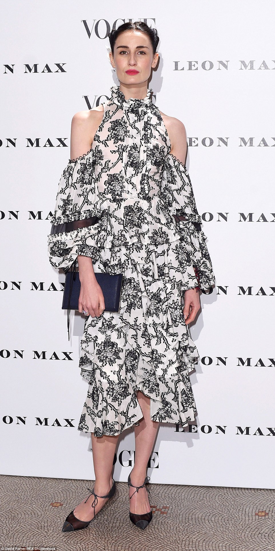 Stauesque: Erin O'Connor - a longtime favourite with couture designers in Paris - wore an eyecatching ruffled halterneck design and toted a Smythson Envelope clutch