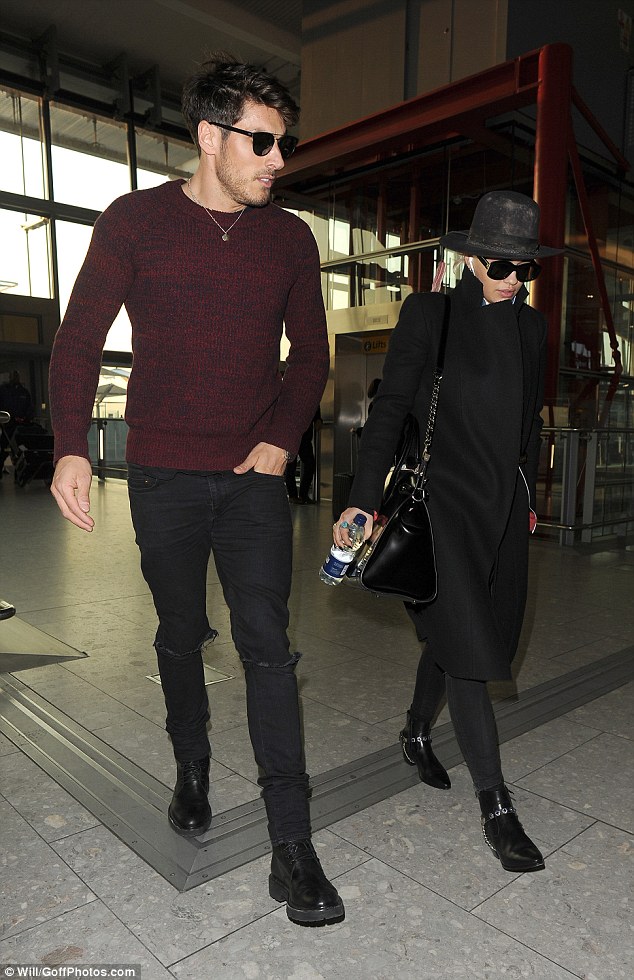 Leggy lady! Slipping her lean pins into a pair of grey leggings, Rita rounded off her outfit with a pair of patent black ankle boots as she strode through the terminal 