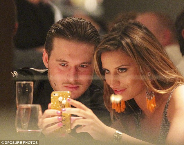 Selfie time: Charlie looked attentive and posed up for a snap of them together on Ferne's mobile phone