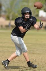 IN STRIDEmdash;Misty Goodnight catches a pass at Wolfpack practice. Goodnightrsquo;s son Riley, 10, will cheer for his mom this season. 