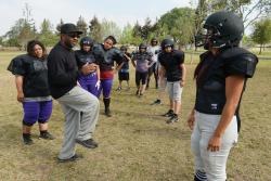 TEACHING FUNDAMENTALSmdash;Ventura County Wolfpack defensive coordinator Kevin Taylor, second from left, talks to his players during thefirst practice with pads last weekend at Rio Lindo Park in Oxnard. 