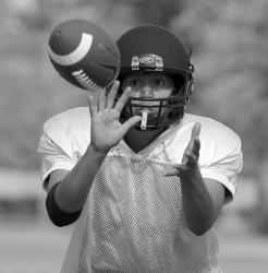 INCOMINGmdash;Sonia Deputee of Camarillo suits up at quarterback for the Ventura County Wolfpack womenrsquo;s tackle football team. 