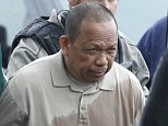 Police take Eulalio Tordil, 62, a suspect in three fatal shootings in the Washington, D.C., area into custody in Bethesda, Md., Friday, May 6, 2016. Tordil is an employee of the Federal Protective Service, which provides security at federal properties. He was put on administrative duties in March after a protective order was issued against him. (AP Photo/Alex Brandon)