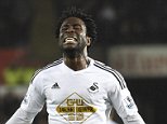 Swansea City's Wilfried Bony celebrates scoring a goal, that was later disallowed, during their English Premier League soccer match at the Liberty Stadium in Swansea, Wales, December 26, 2014. REUTERS/Rebecca Naden (BRITAIN - Tags: SPORT SOCCER) NO USE WITH UNAUTHORIZED AUDIO, VIDEO, DATA, FIXTURE LISTS, CLUB/LEAGUE LOGOS OR LIVE SERVICES. ONLINE IN-MATCH USE LIMITED TO 45 IMAGES, NO VIDEO EMULATION. NO USE IN BETTING, GAMES OR SINGLE CLUB/LEAGUE/PLAYER PUBLICATIONS. FOR EDITORIAL USE ONLY. NOT FOR SALE FOR MARKETING OR ADVERTISING CAMPAIGNS