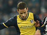 TURIN, ITALY - DECEMBER 09:  Roberto Pereyra (R) of Juventus clashes with Mario Suarez of Club Atletico de Madrid during the UEFA Champions League group A match between Juventus and Club Atletico de Madrid at Juventus Arena on December 9, 2014 in Turin, Italy.  (Photo by Valerio Pennicino/Getty Images)