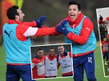 ST ALBANS, ENGLAND - DECEMBER 31:  (L-R) Santi Cazorla and Alexis Sanchez of of Arsenal during a training session at London Colney on December 31, 2014 in St Albans, England.  (Photo by Stuart MacFarlane/Arsenal FC via Getty Images)