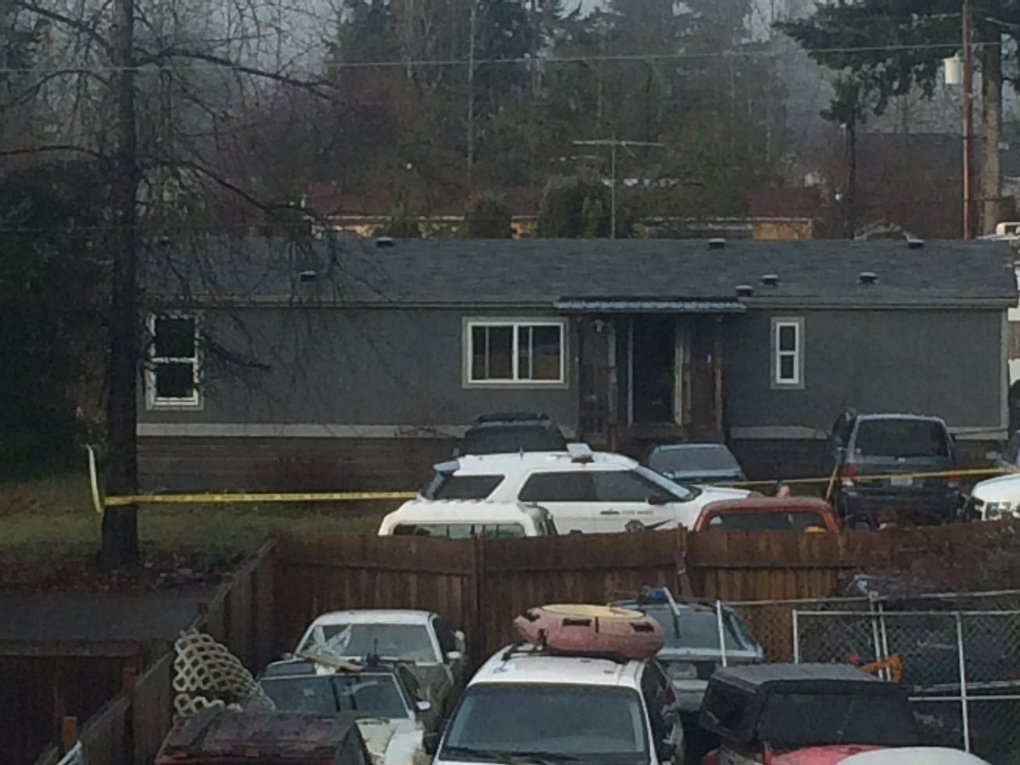 Deputy Daniel McCartney was responding to a reported home invasion at this gray house, viewed from a neighboring home. (Sara Jean Green / The Seattle Times)