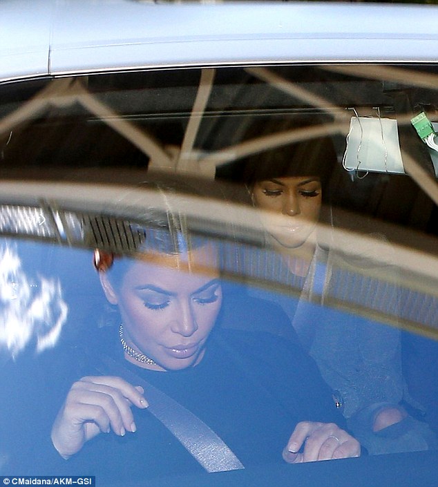 Banned: Kim Kardashian and Kourtney were pictured in LA on Tuesday visiting Lamar Odom