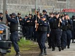 Law enforcement gather in front of the prison early thursday morning in Dannemora to investigate a lead in the capture of the missing inmates. Shawn LaChapelle for the Dailymail.com