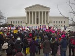 A crowd gathers outside the Supreme Court in Washington, Wednesday, March 4, 2015, as the court hears arguments in King v. Burwell, a major test of President Barack Obama's health overhaul which, if successful, could halt health care premium subsidies in all the states where the federal government runs the insurance marketplaces. (AP Photo/Pablo Martinez Monsivais)