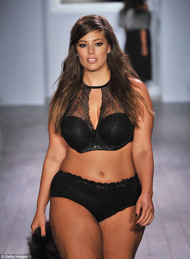 Catwalk queen: Ashley Graham is pictured walking down the runway during the Addition Elle/Ashley Graham Lingerie Collection fashion show in September 