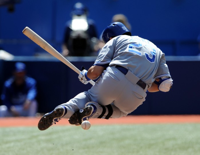 Kansas City Royals right fielder Nori Aoki is struck by a pitch from Toronto Blue Jays relief pitcher Todd Redmond (not pictured) in the seventh inning at Rogers Centre. (Dan Hamilton/USA TODAY Sports)