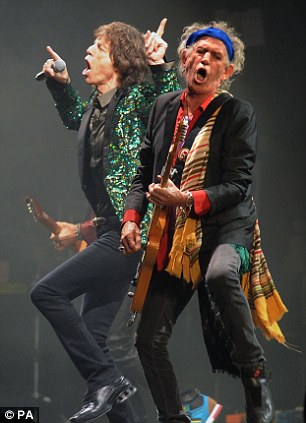 Mick Jagger (left) and Keith Richards (right) from the Rolling Stones perform on the Pyramid Stage during Glastonbury 2013