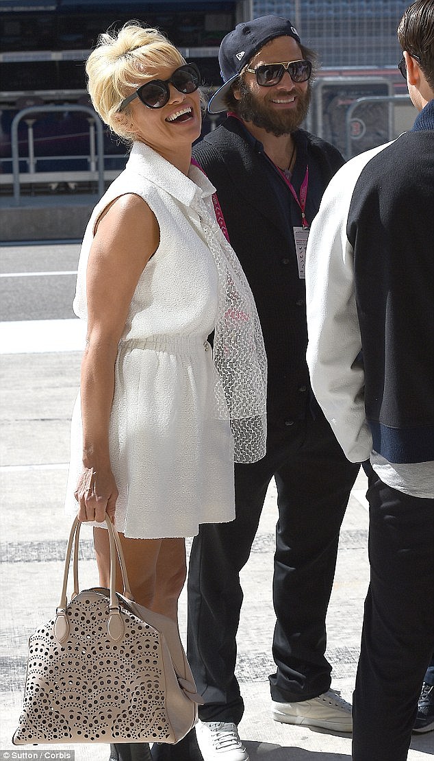 Happy at last: Pamela and Rick were seen holding hands at the Formula One World Championship Grand Prix Qualifying event in Austin last month