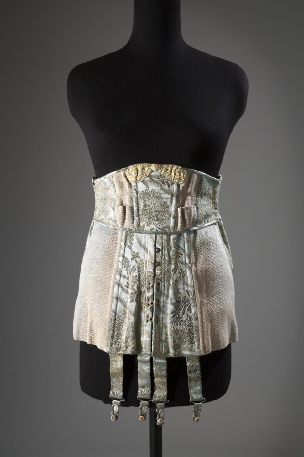 A corset in brocade satin and elastic, a U.S. garment, circa 1920 from Strouse, Adler Co.