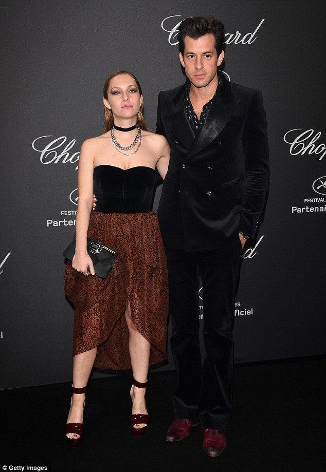 Cool couple: Mark went for his usual brand of quirky cool in a patterned shirt with a slick black suit, while his stunning wife went super kooky for the night in a mullet-hemmed bustier topped gown